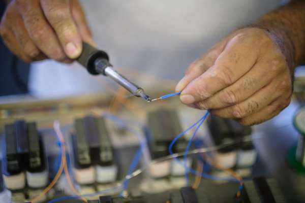hands soldering wire
